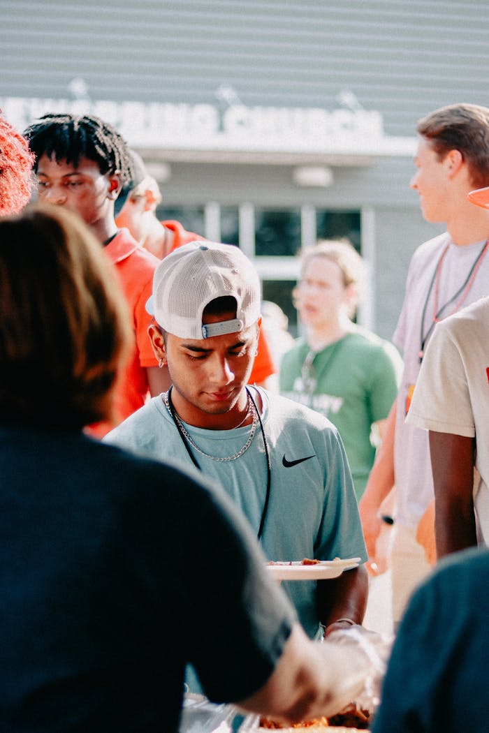 People enjoying an outdoor church event with food and fellowship.