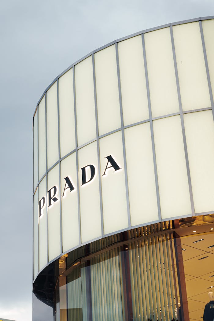 Exterior of a Prada store in Istanbul with sleek modern architecture under cloudy skies.